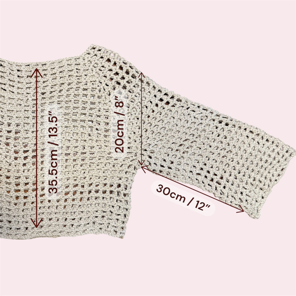 A white mesh crochet top with measurements added