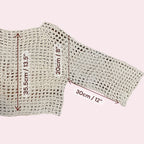 A white mesh crochet top with measurements added