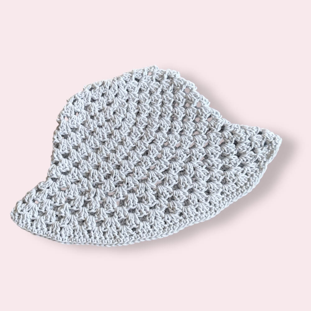 Baby blue crochet bucket hat on plain background