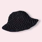 Black crochet bucket hat on plain background