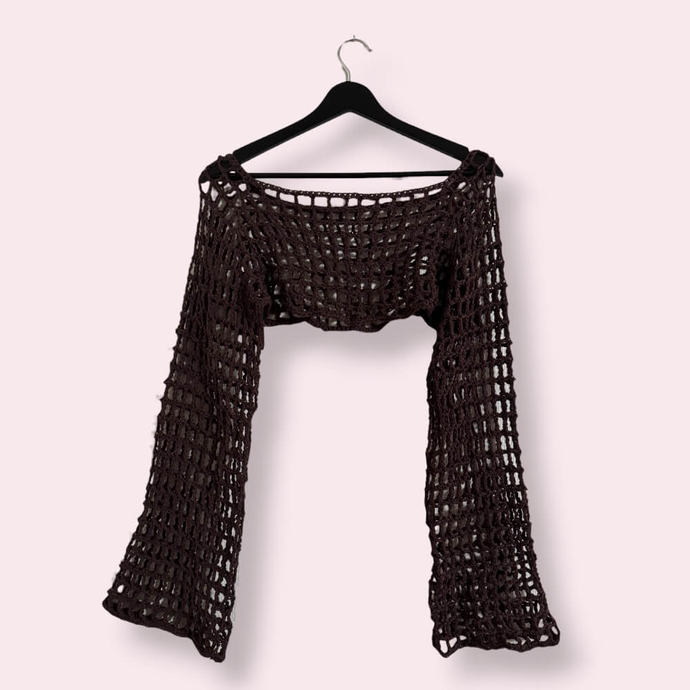 Brown crochet mesh sleeves on clothes hanger on plain background