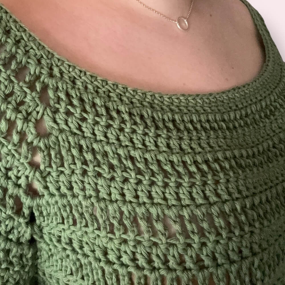 Close-up of a green crochet top texture