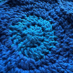 Close up texture of blue crochet coaster
