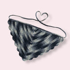 Crochet bandana in blue colors on plain background