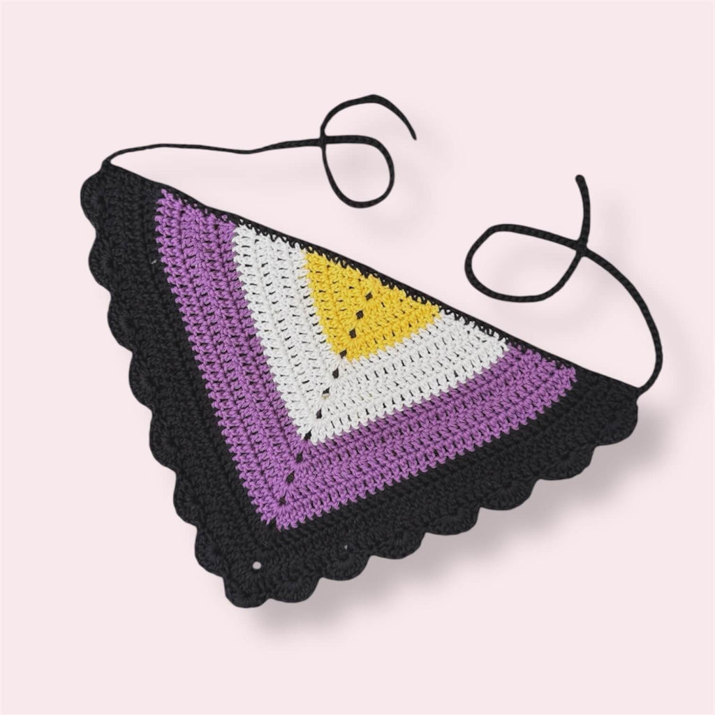 Crochet bandana in nonbinary pride colors on plain background
