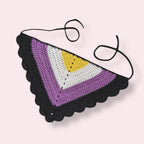 Crochet bandana in nonbinary pride colors on plain background