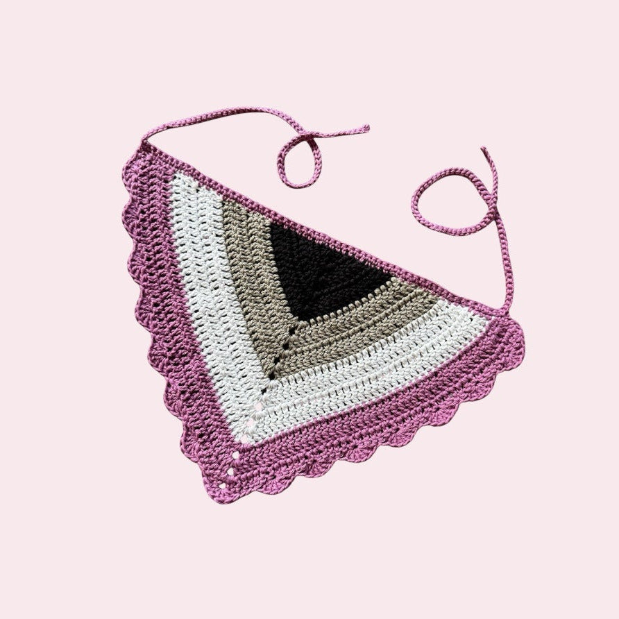 Crochet cotton bandana in asexual pride colors on a pink background