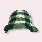 Crocheted green gingham bucket hat on plain background