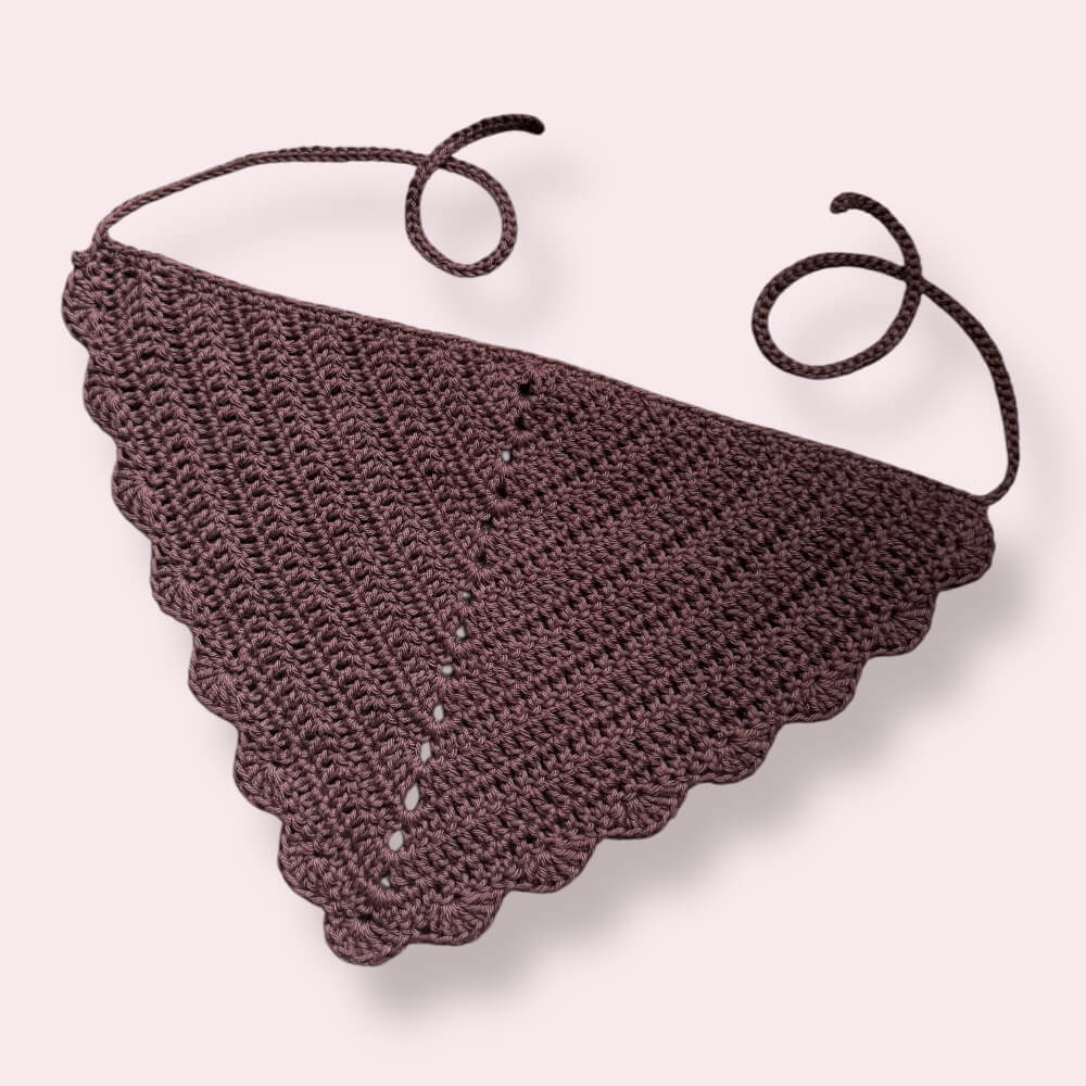 Dark brown crochet bandana on plain background