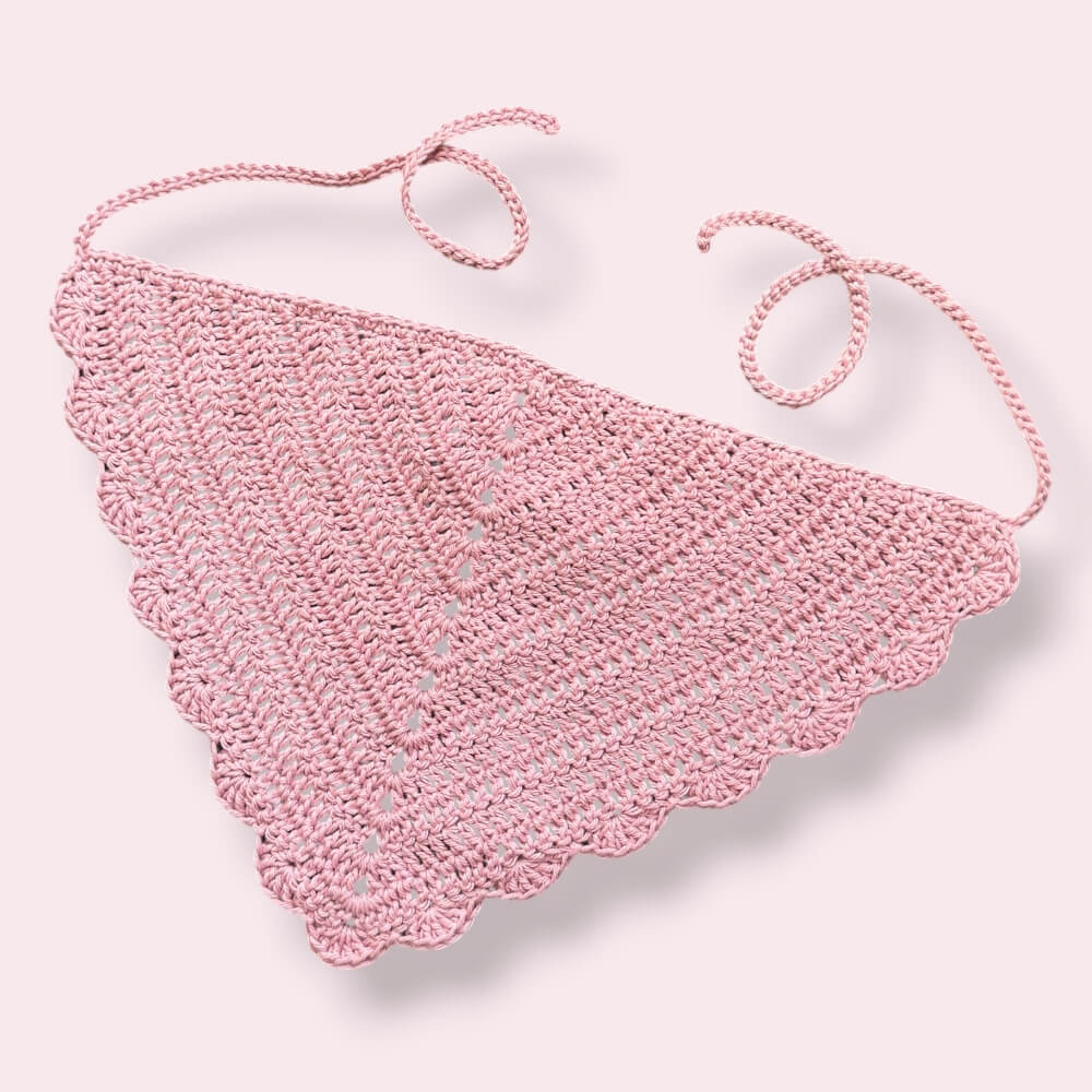 Dusty pink crochet hair bandana on plain background