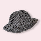 Gray crochet bucket hat on plain background