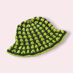 Green striped crochet bucket hat on plain background