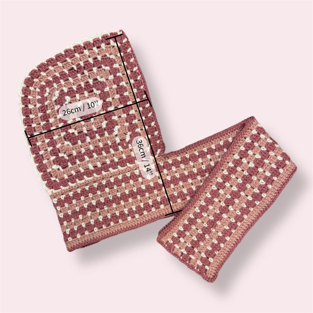 Crocheted hooded scarf with measurements on plain background