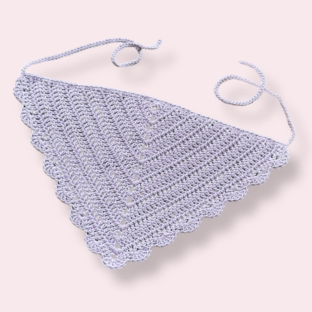 Light purple crochet bandana on plain background
