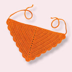 Orange crochet hair bandana on plain background
