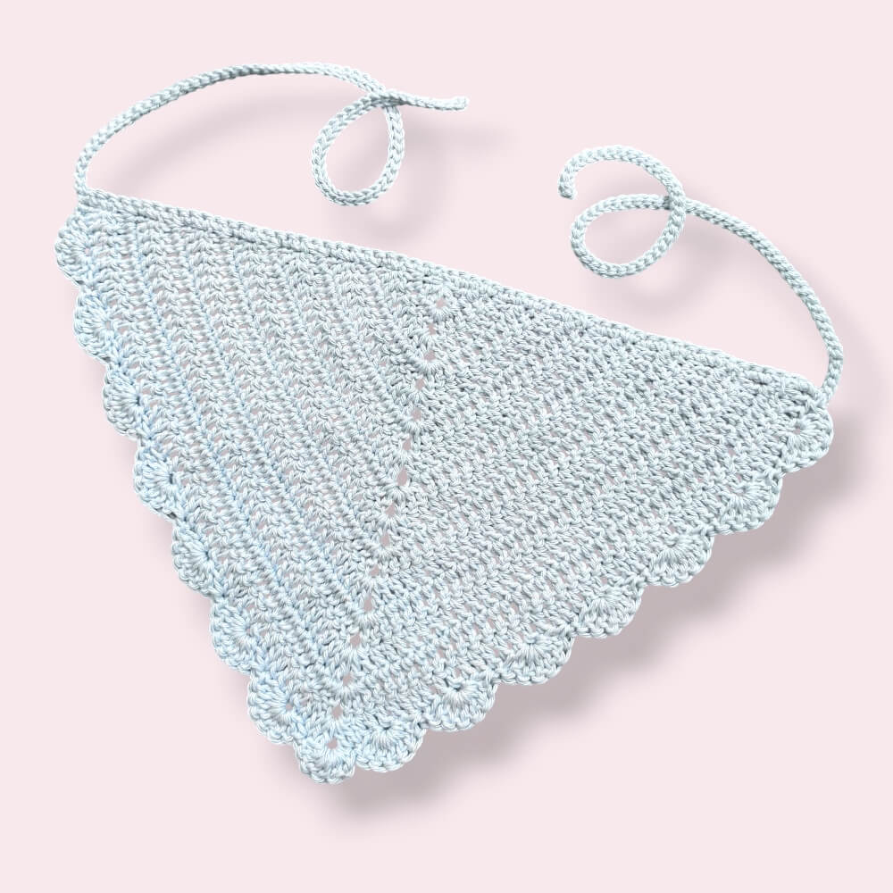 Pastel blue crochet hair bandana on plain background