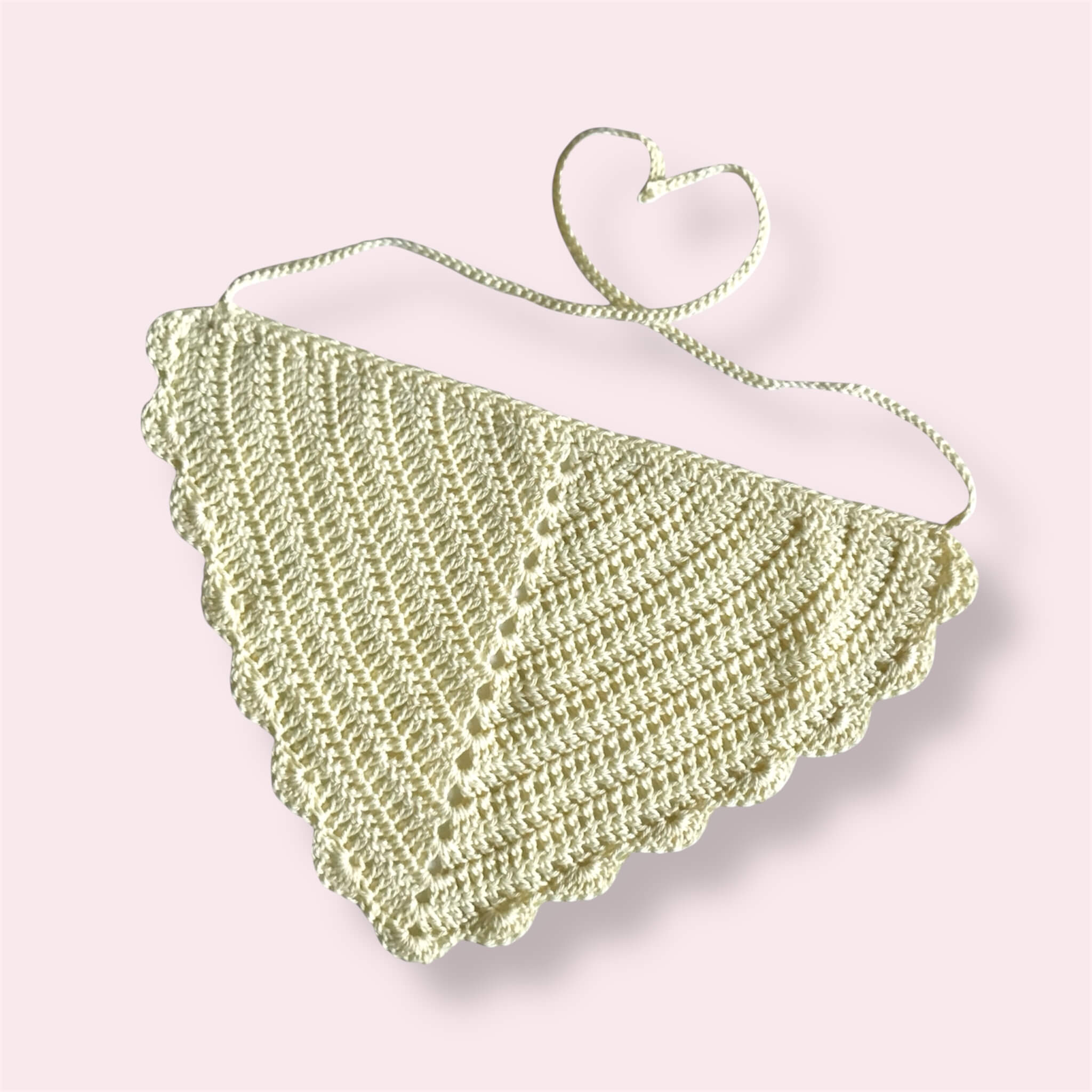 Pastel yellow crocheted bandana on plain background