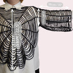 Person wearing a black spiderweb shirt with measurements on a plain background