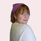 Person wearing a purple crochet bandana against a plain background
