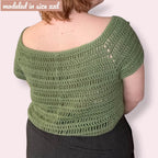Person wearing crochet tee with «modeled in size XXL» overlayed