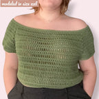 Person wearing crocheted tee with «modeled in size XXL» overlayed