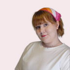 Person wearing lesbian pride crochet bandana on plain background