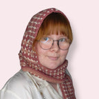 Person wearing pink hooded scarf front view closeup