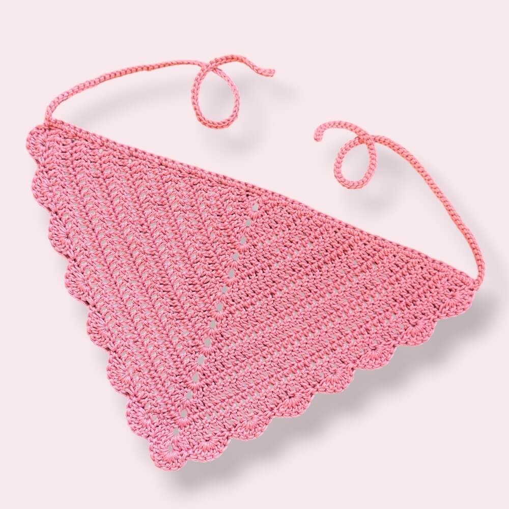 Pink crochet hair bandana on plain background