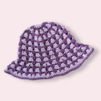 Purple striped crochet bucket hat on a plain background