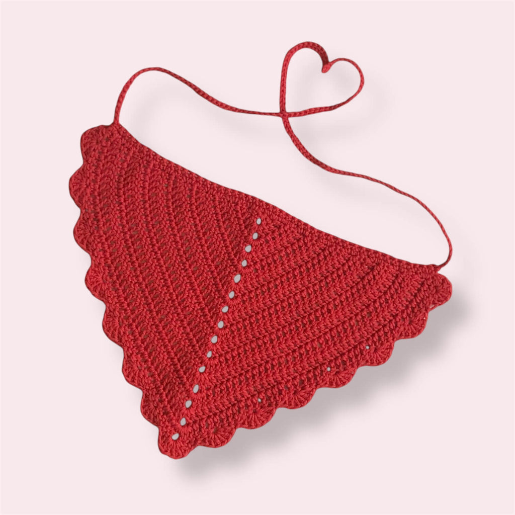 Red crocheted bandana on plain background