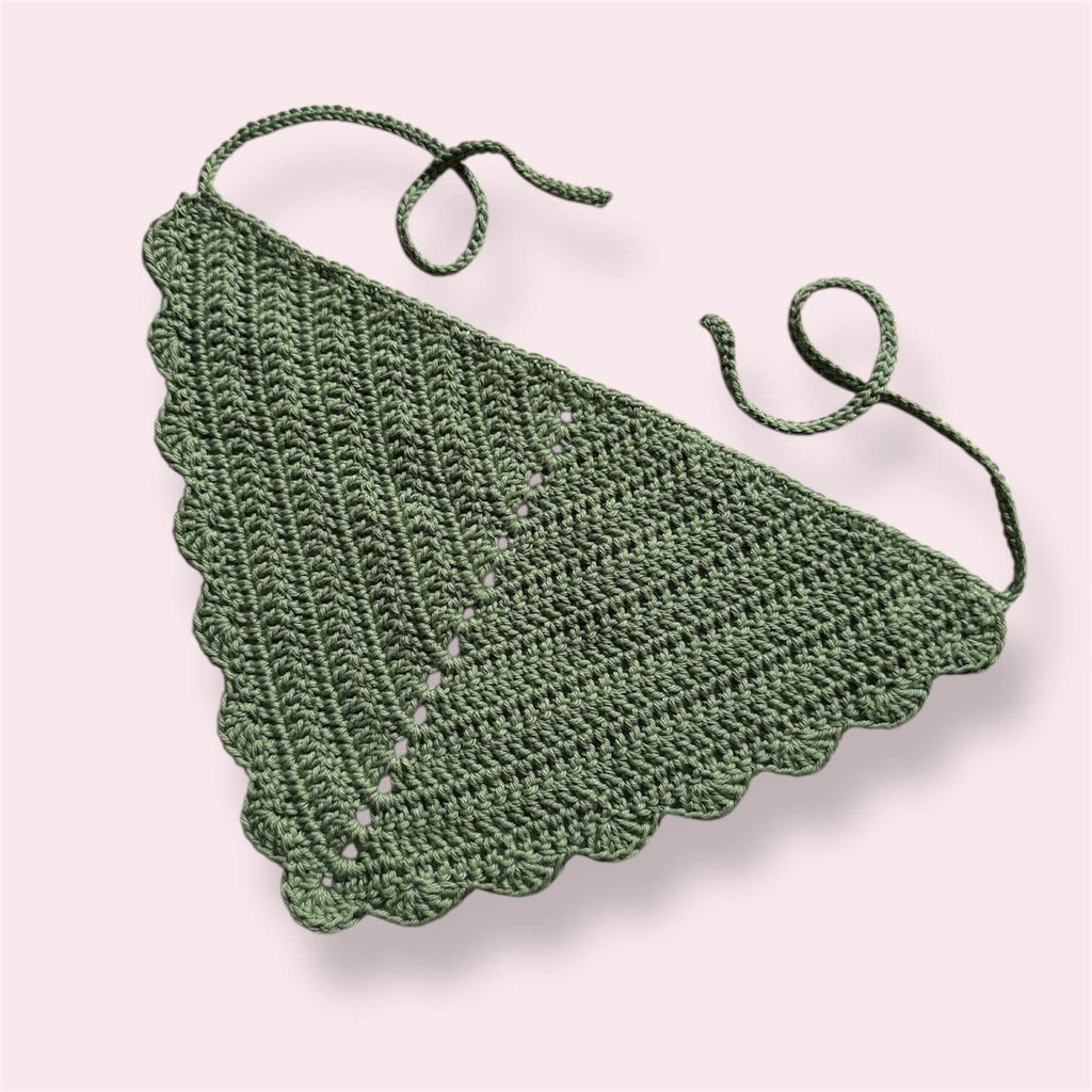 Sage green crocheted bandana on plain background