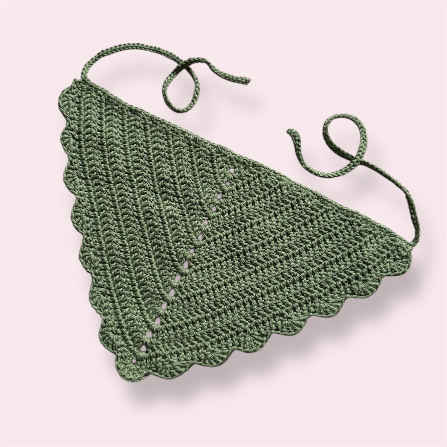 Sage green crocheted bandana on plain background