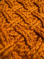 Textured orange crochet surface