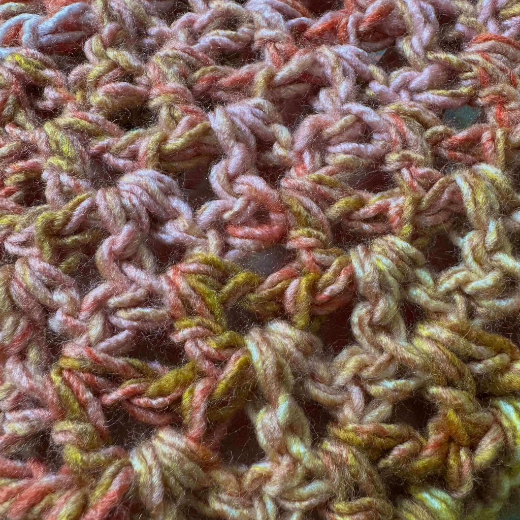 Close-up of textured multicolor crochet scarf