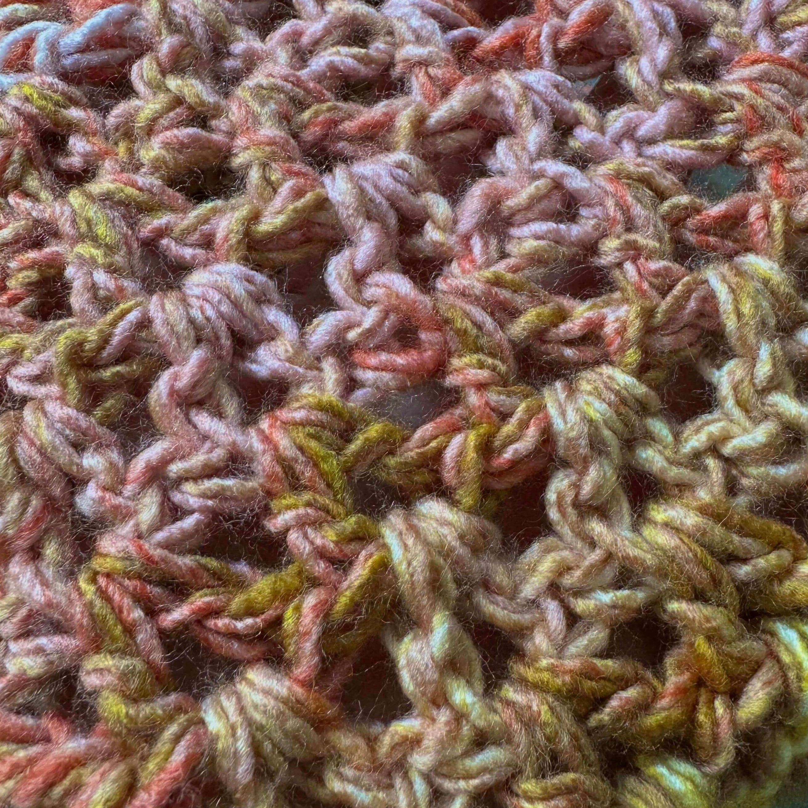 Close-up of textured multicolor crochet scarf