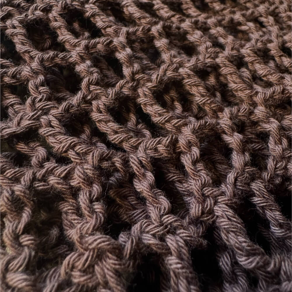 Up close texture shot of brown crochet sleeves