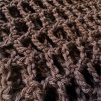 Up close texture shot of brown crochet sleeves