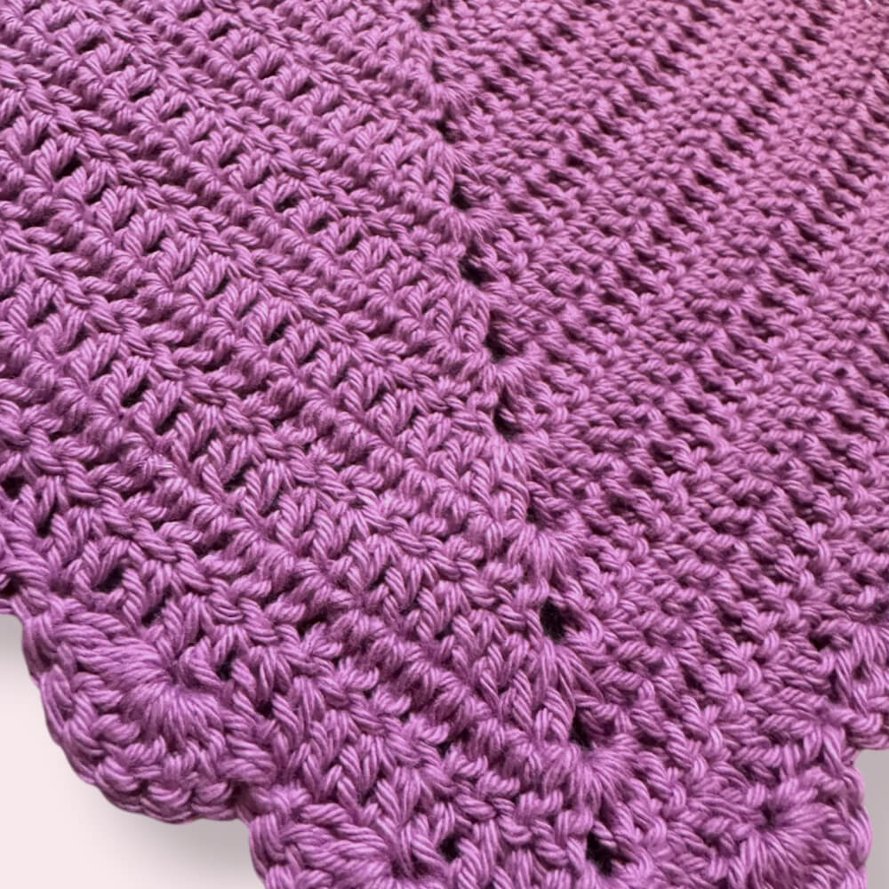 Up close texture shot of purple crochet bandana