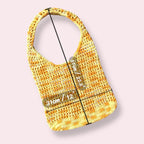 Yellow crochet tote bag with measurements on plain background