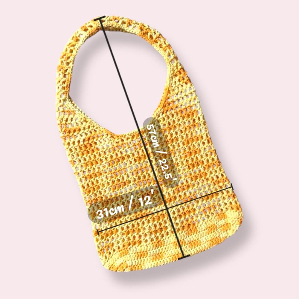 Yellow crochet tote bag with measurements on plain background